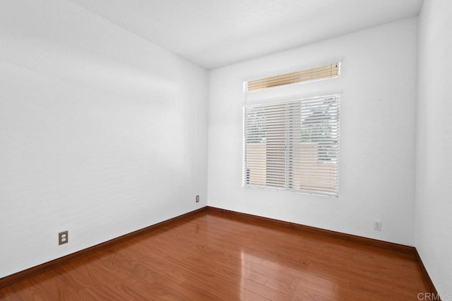 7254 Shoreline Dr Unit 131, San Diego, CA 92122 - spare room featuring wood finished floors and baseboards