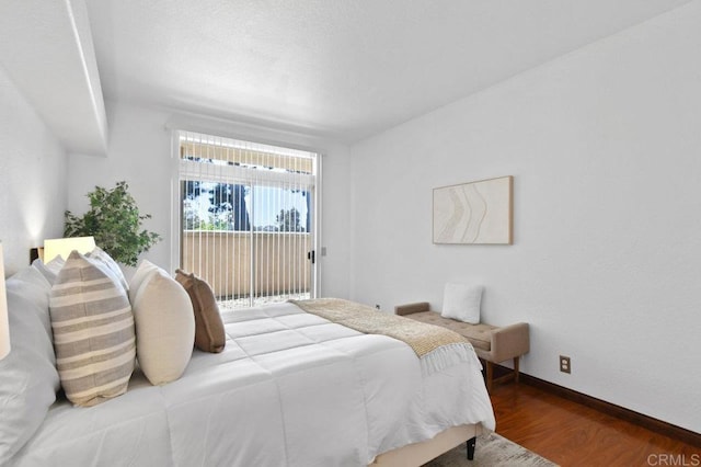 7254 Shoreline Dr Unit 131, San Diego, CA 92122 - bedroom featuring wood finished floors, access to outside, and baseboards