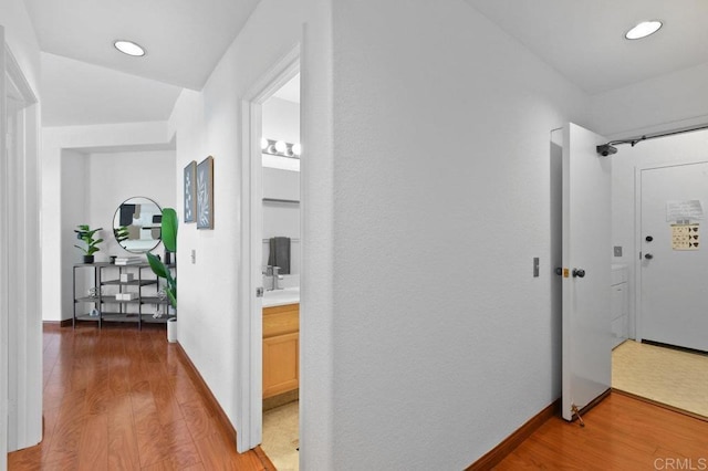 7254 Shoreline Dr Unit 131, San Diego, CA 92122 - hall with light wood-style floors, baseboards, and recessed lighting