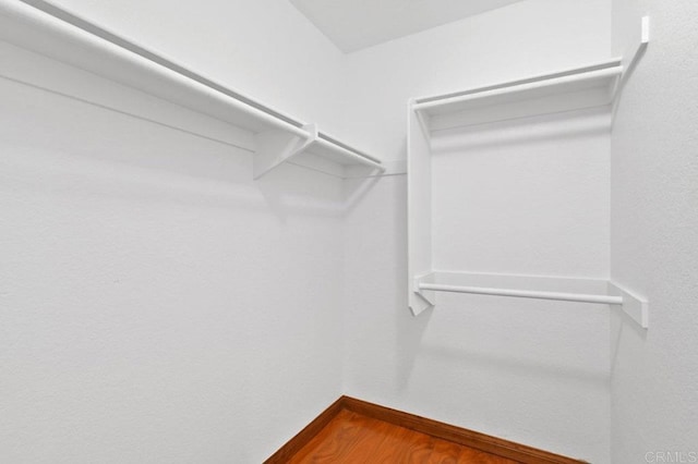 7254 Shoreline Dr Unit 131, San Diego, CA 92122 - walk in closet featuring wood finished floors