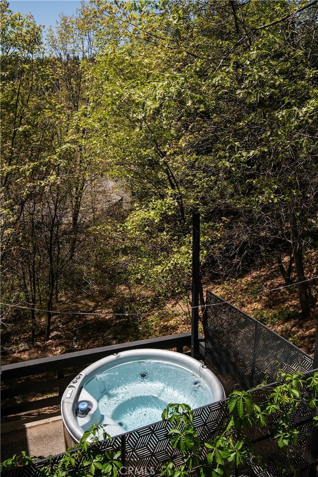 27663 N Bay Rd, Lake Arrowhead, CA 92352 - view of pool with a hot tub and a wooded view