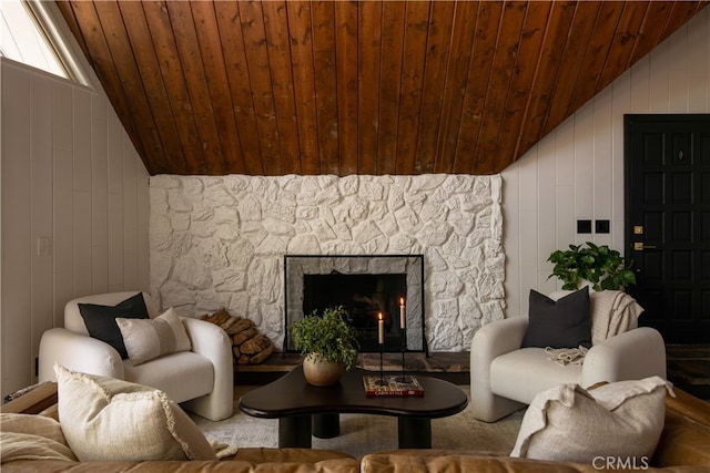 27663 N Bay Rd, Lake Arrowhead, CA 92352 - living room featuring vaulted ceiling, wood ceiling, a stone fireplace, and wood walls