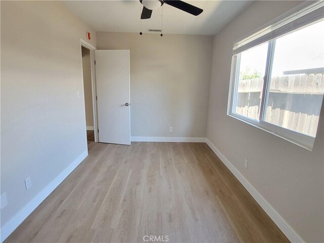15475 Shadow Mountain Ln, Lake Elsinore, CA 92530 - unfurnished room with wood finished floors and ceiling fan