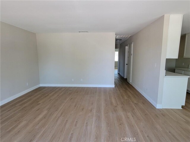 15475 Shadow Mountain Ln, Lake Elsinore, CA 92530 - spare room with light wood-style flooring and baseboards
