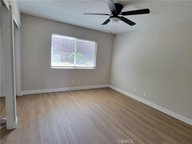 15475 Shadow Mountain Ln, Lake Elsinore, CA 92530 - unfurnished bedroom featuring light wood finished floors, a closet, and ceiling fan