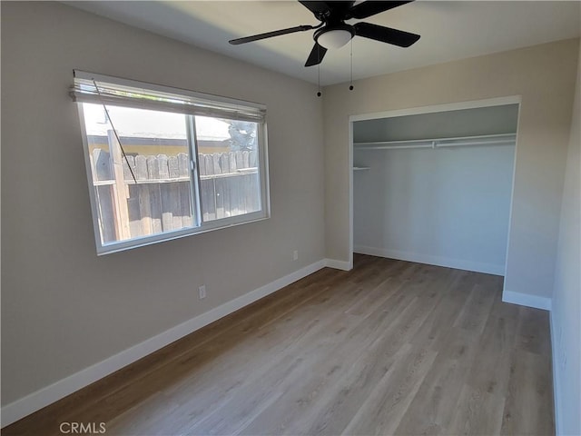 15475 Shadow Mountain Ln, Lake Elsinore, CA 92530 - unfurnished bedroom with wood finished floors, a closet, and ceiling fan