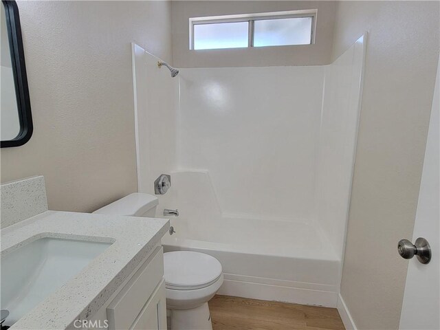15475 Shadow Mountain Ln, Lake Elsinore, CA 92530 - bathroom with washtub / shower combination, vanity, and wood finished floors