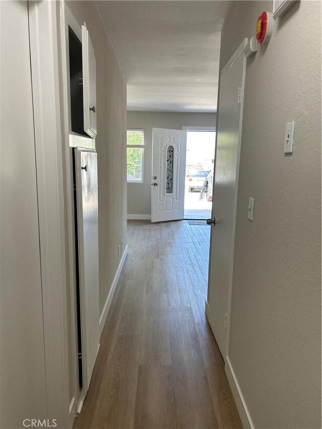 15475 Shadow Mountain Ln, Lake Elsinore, CA 92530 - corridor featuring wood finished floors and baseboards