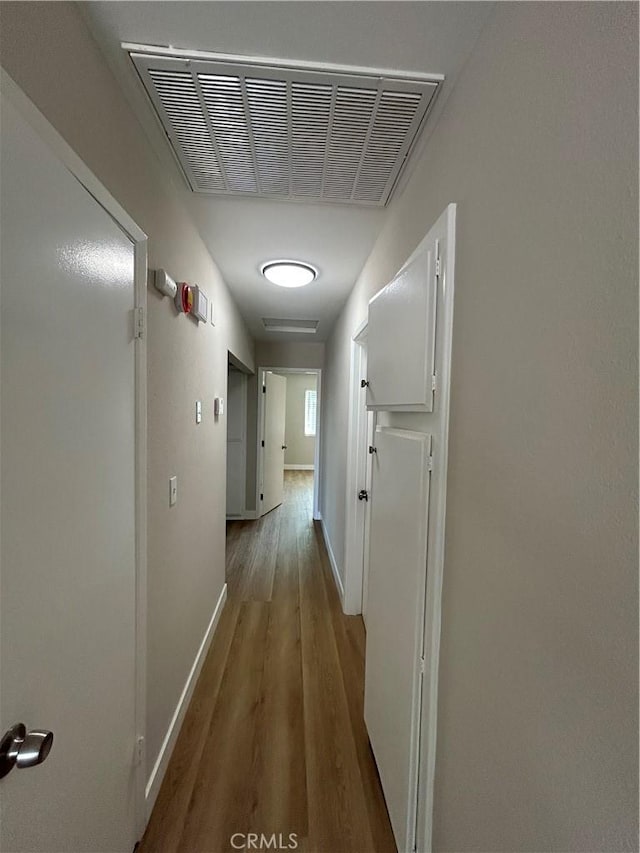 15475 Shadow Mountain Ln, Lake Elsinore, CA 92530 - hallway with baseboards and wood finished floors