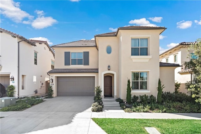 113 Imagination Trl, Irvine, CA 92620 - mediterranean / spanish-style house featuring stucco siding, driveway, and an attached garage