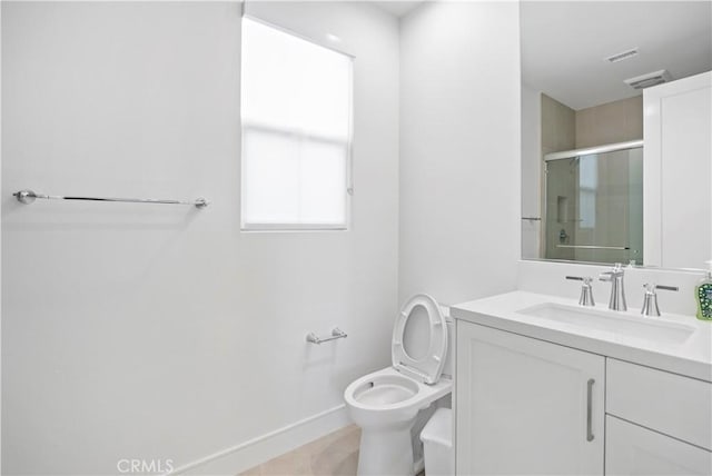113 Imagination Trl, Irvine, CA 92620 - full bathroom with vanity, a shower stall, baseboards, and toilet