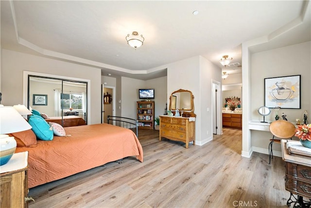10204 Mount Olympus Valley Rd, Fallbrook, CA 92028 - bedroom with light wood-style flooring, baseboards, and connected bathroom