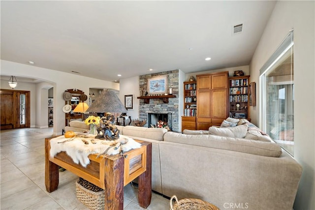 10204 Mount Olympus Valley Rd, Fallbrook, CA 92028 - living room with arched walkways, light tile patterned flooring, a fireplace, and recessed lighting