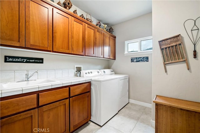 10204 Mount Olympus Valley Rd, Fallbrook, CA 92028 - laundry area with cabinet space, washer and clothes dryer, light tile patterned flooring, and baseboards