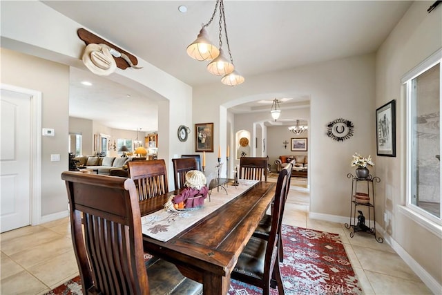 10204 Mount Olympus Valley Rd, Fallbrook, CA 92028 - dining space with arched walkways, light tile patterned floors, a chandelier, and plenty of natural light