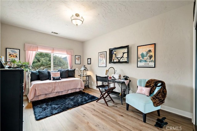 10204 Mount Olympus Valley Rd, Fallbrook, CA 92028 - bedroom with wood finished floors, baseboards, and a textured ceiling