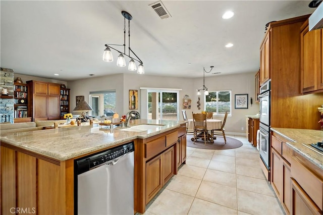 10204 Mount Olympus Valley Rd, Fallbrook, CA 92028 - kitchen featuring appliances with stainless steel finishes, a sink, brown cabinets, recessed lighting, and decorative light fixtures
