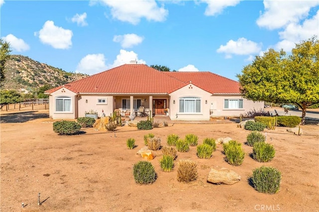 10204 Mount Olympus Valley Rd, Fallbrook, CA 92028 - rear view of house with stucco siding, a tile roof, covered porch, and a chimney