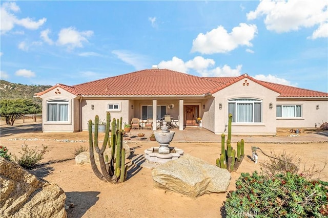 10204 Mount Olympus Valley Rd, Fallbrook, CA 92028 - rear view of property with a tile roof, stucco siding, and a patio
