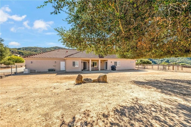 10204 Mount Olympus Valley Rd, Fallbrook, CA 92028 - rear view of property featuring a tile roof, a patio, stucco siding, and central air condition unit