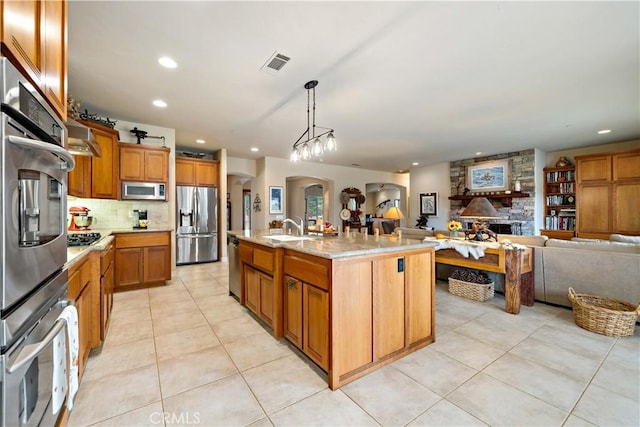 10204 Mount Olympus Valley Rd, Fallbrook, CA 92028 - kitchen with stainless steel appliances, open floor plan, light tile patterned flooring, decorative backsplash, and recessed lighting