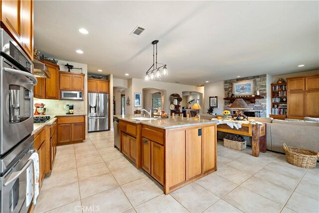 10204 Mount Olympus Valley Rd, Fallbrook, CA 92028 - kitchen featuring appliances with stainless steel finishes, open floor plan, light tile patterned flooring, tasteful backsplash, and recessed lighting