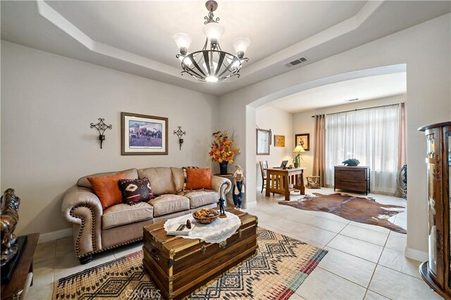 10204 Mount Olympus Valley Rd, Fallbrook, CA 92028 - living area with a tray ceiling, arched walkways, a chandelier, and light tile patterned flooring
