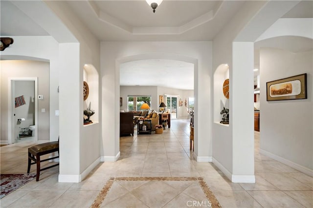 10204 Mount Olympus Valley Rd, Fallbrook, CA 92028 - hall with arched walkways, baseboards, and a raised ceiling