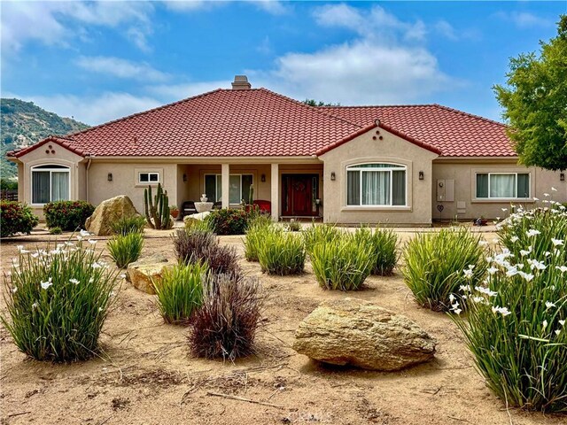 10204 Mount Olympus Valley Rd, Fallbrook, CA 92028 - view of front of property featuring a tile roof, stucco siding, and a chimney