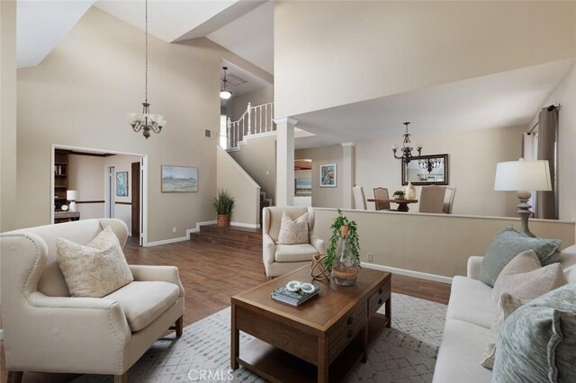 5941 E Valley Forge Dr, Orange, CA 92869 - living area featuring a chandelier, wood finished floors, high vaulted ceiling, and baseboards