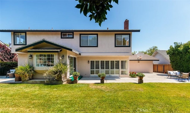 5941 E Valley Forge Dr, Orange, CA 92869 - back of property featuring a patio area, stucco siding, and a chimney