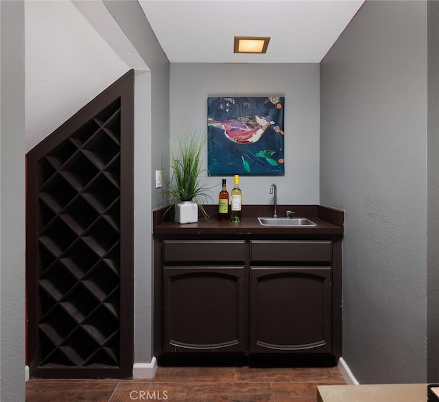 5941 E Valley Forge Dr, Orange, CA 92869 - indoor wet bar with dark wood-type flooring and baseboards