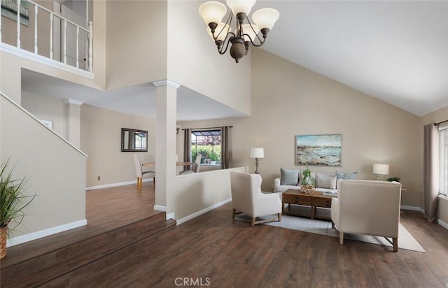5941 E Valley Forge Dr, Orange, CA 92869 - living area featuring high vaulted ceiling, wood finished floors, ornate columns, a chandelier, and baseboards