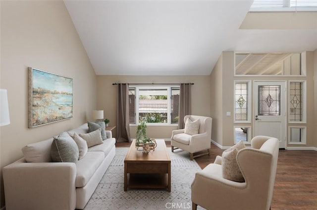 5941 E Valley Forge Dr, Orange, CA 92869 - living room featuring lofted ceiling, wood finished floors, and baseboards