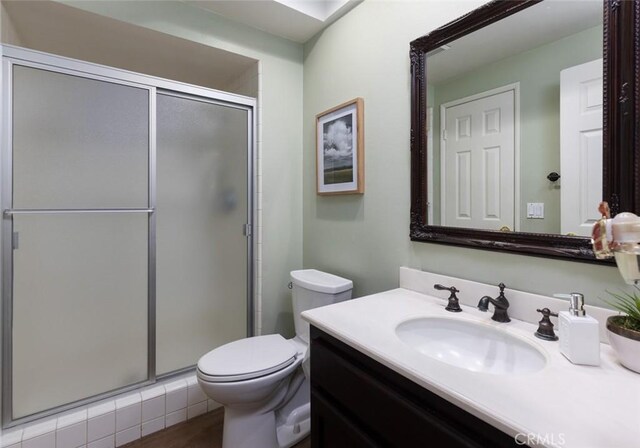 5941 E Valley Forge Dr, Orange, CA 92869 - full bathroom with toilet, vanity, and a stall shower