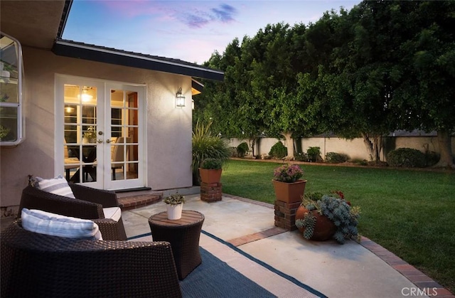 5941 E Valley Forge Dr, Orange, CA 92869 - patio terrace at dusk featuring french doors and a patio area