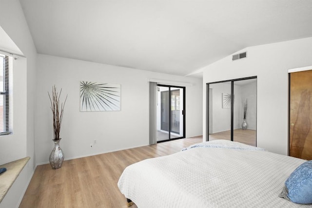 2125 Prospect St, National City, CA 91950 - bedroom with multiple windows, vaulted ceiling, multiple closets, light wood-style floors, and access to exterior