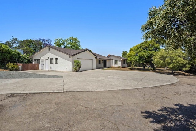 2125 Prospect St, National City, CA 91950 - view of front of house featuring concrete driveway, an attached garage, and stucco siding
