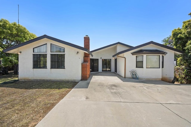 2125 Prospect St, National City, CA 91950 - view of front of home with a chimney and stucco siding