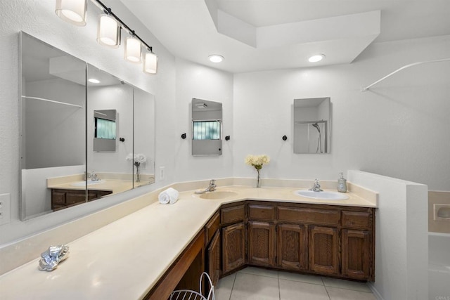 2125 Prospect St, National City, CA 91950 - bathroom with tile patterned flooring, double vanity, and a tub