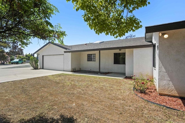 2125 Prospect St, National City, CA 91950 - view of front of property featuring a garage, stucco siding, driveway, a front lawn, and a shingled roof
