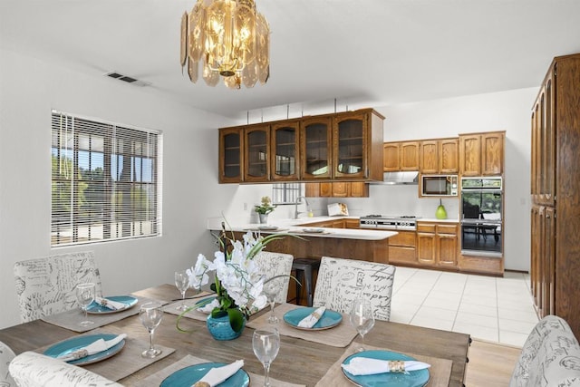 2125 Prospect St, National City, CA 91950 - dining room featuring a chandelier and healthy amount of natural light