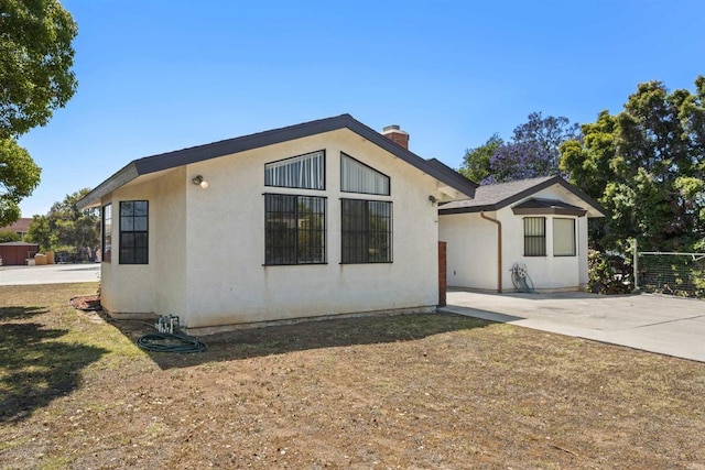 2125 Prospect St, National City, CA 91950 - view of front of house with a chimney and stucco siding
