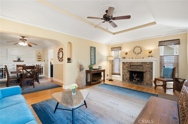 1260 Sinaloa Ave, Pasadena, CA 91104 - living room with ceiling fan, a raised ceiling, wood finished floors, baseboards, and crown molding