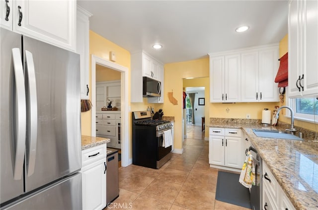 1260 Sinaloa Ave, Pasadena, CA 91104 - kitchen featuring appliances with stainless steel finishes, a sink, light tile patterned floors, white cabinets, and recessed lighting