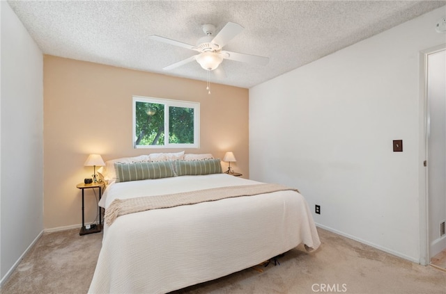 1260 Sinaloa Ave, Pasadena, CA 91104 - bedroom featuring light carpet, baseboards, a textured ceiling, and a ceiling fan