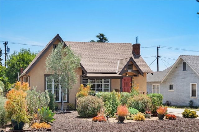 1260 Sinaloa Ave, Pasadena, CA 91104 - tudor home with stucco siding, a chimney, and roof with shingles