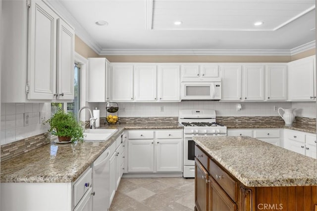 32295 Via Arias, Temecula, CA 92592 - kitchen featuring white appliances, white cabinets, a sink, crown molding, and recessed lighting