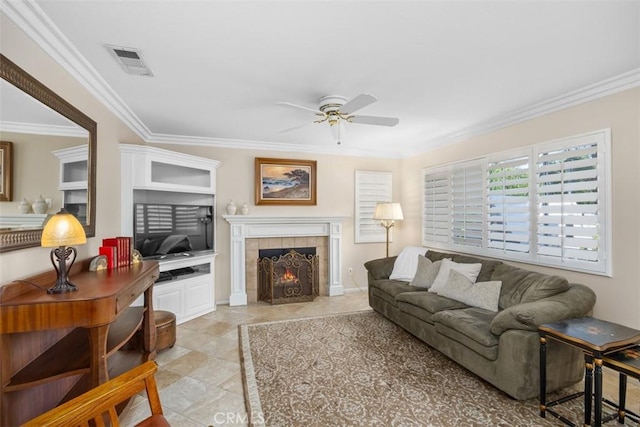 32295 Via Arias, Temecula, CA 92592 - living area with ceiling fan, crown molding, and a tiled fireplace