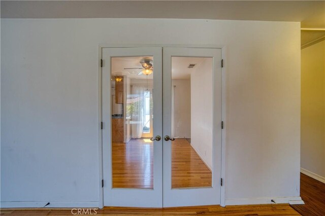273 Almond St, San Luis Obispo, CA 93405 - unfurnished bedroom with french doors, wood finished floors, and baseboards